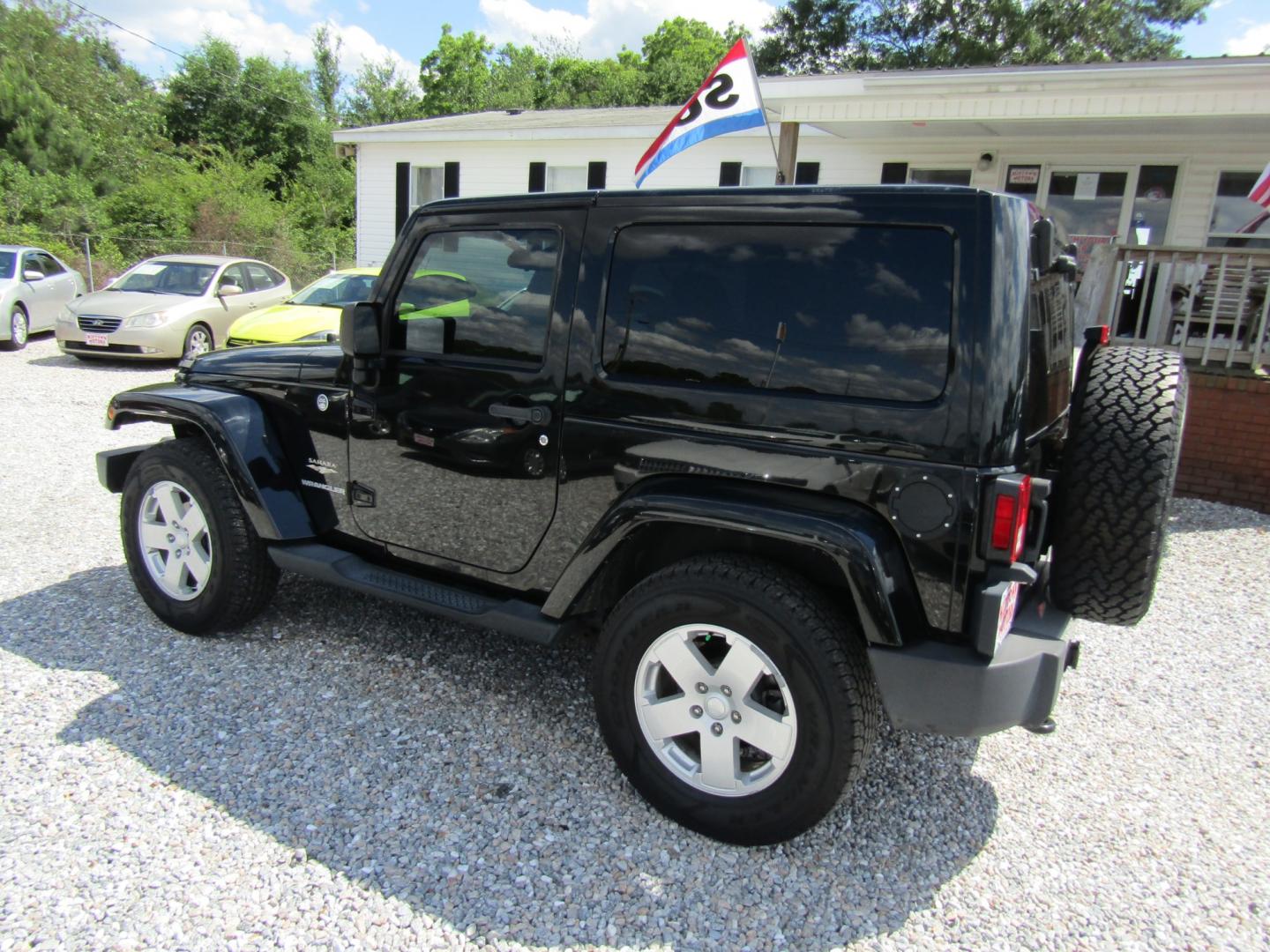 2012 Black /Tan Jeep Wrangler Sahara 4WD (1C4GJWBG2CL) with an 3.6L V6 DOHC 24V FFV engine, Automatic transmission, located at 15016 S Hwy 231, Midland City, AL, 36350, (334) 983-3001, 31.306210, -85.495277 - Photo#4